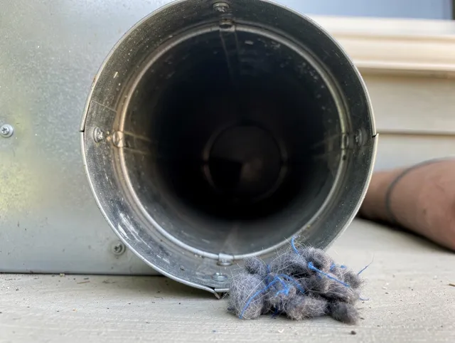 Strongsville Dryer Vent Cleaning technician using specialized equipment to clear severe dryer vent blockage in Strongsville